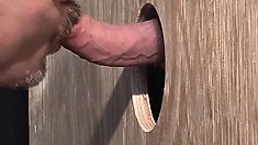 This gay found a handy gloryhole and is chewing on that piece of meat