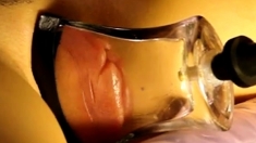 pumped pussy lips in a tight, flat glass tube